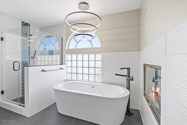 2842 Via Florentine St, Henderson, NV 89074 - full bath with a freestanding bath, a shower stall, and tile walls