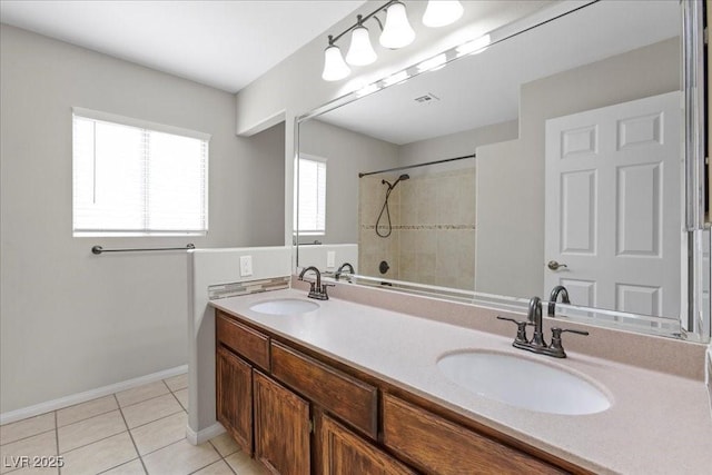 2842 Via Florentine St, Henderson, NV 89074 - bathroom featuring double vanity, tile patterned flooring, and a tile shower