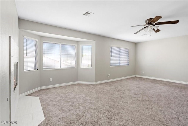 2842 Via Florentine St, Henderson, NV 89074 - carpeted empty room with healthy amount of natural light and ceiling fan