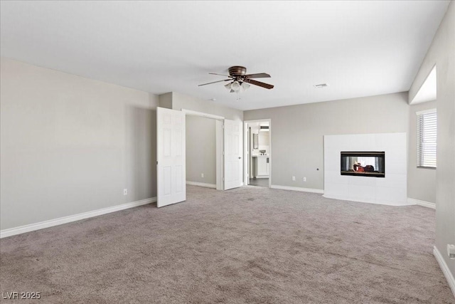 2842 Via Florentine St, Henderson, NV 89074 - unfurnished living room featuring a ceiling fan, carpet flooring, and a tile fireplace