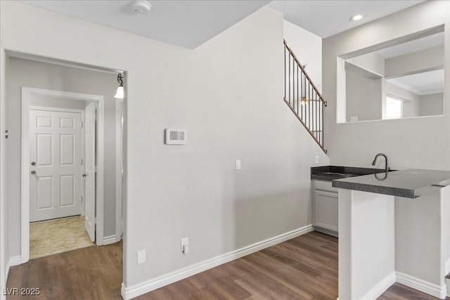 2842 Via Florentine St, Henderson, NV 89074 - bar area featuring dark wood finished floors and stairway