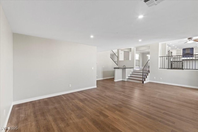 2842 Via Florentine St, Henderson, NV 89074 - unfurnished living room featuring stairs, wood finished floors, recessed lighting, and a ceiling fan