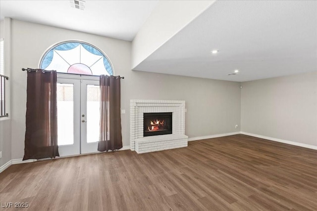 2842 Via Florentine St, Henderson, NV 89074 - foyer with wood finished floors, french doors, a fireplace, and recessed lighting