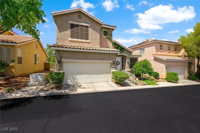 10372 Natural Springs Ave, Las Vegas, NV 89129 - mediterranean / spanish-style home featuring stucco siding, a tile roof, concrete driveway, and a garage