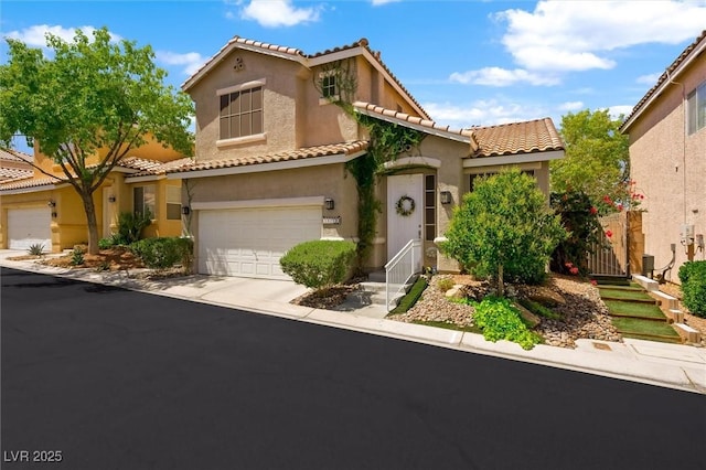 10372 Natural Springs Ave, Las Vegas, NV 89129 - mediterranean / spanish house featuring stucco siding, a tile roof, a garage, and driveway