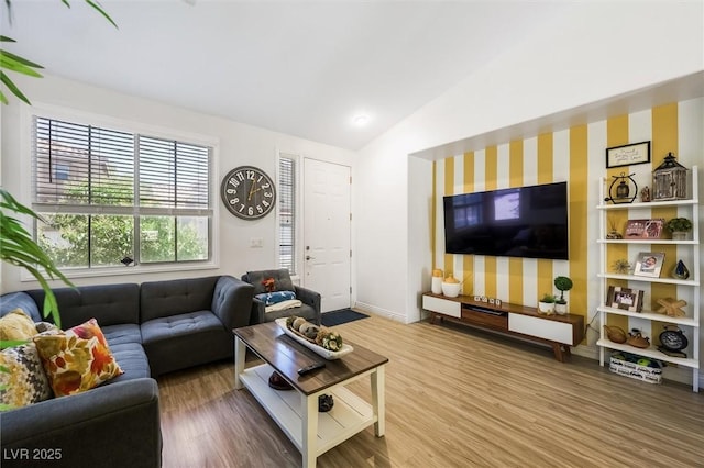 10372 Natural Springs Ave, Las Vegas, NV 89129 - living room featuring vaulted ceiling, wood finished floors, and wallpapered walls