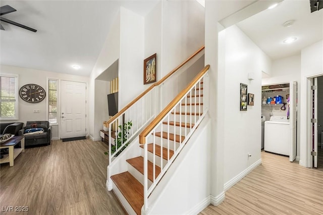 10372 Natural Springs Ave, Las Vegas, NV 89129 - stairway featuring washer / dryer, wood finished floors, ceiling fan, and vaulted ceiling