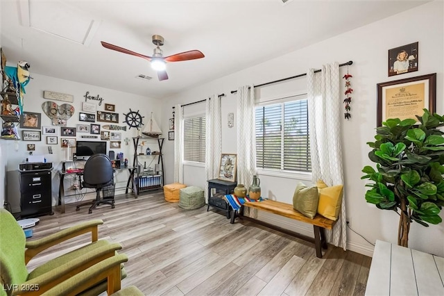 10372 Natural Springs Ave, Las Vegas, NV 89129 - home office with light wood-style floors and a ceiling fan