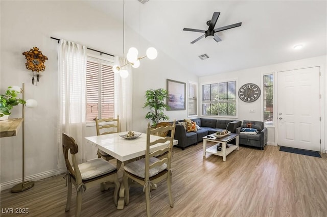 10372 Natural Springs Ave, Las Vegas, NV 89129 - dining area featuring light wood-style floors, a ceiling fan, and vaulted ceiling