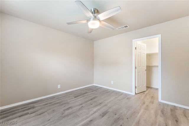 9578 Teton Vista Ave, Las Vegas, NV 89117 - unfurnished room featuring a ceiling fan and light wood-style flooring