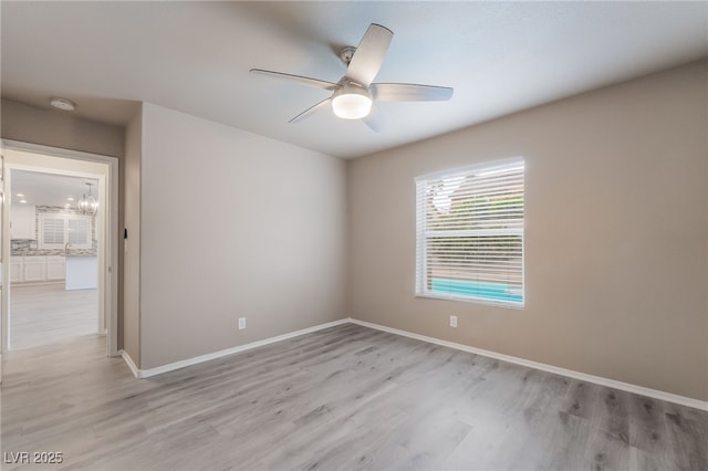 9578 Teton Vista Ave, Las Vegas, NV 89117 - spare room with a smoke detector, light wood-style flooring, and ceiling fan