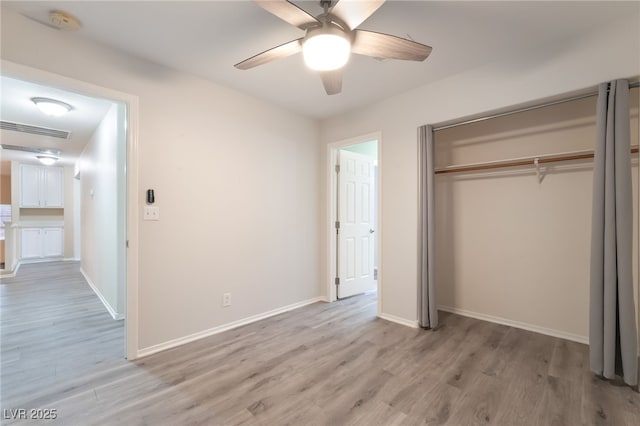 9578 Teton Vista Ave, Las Vegas, NV 89117 - unfurnished bedroom with light wood finished floors, a closet, and ceiling fan