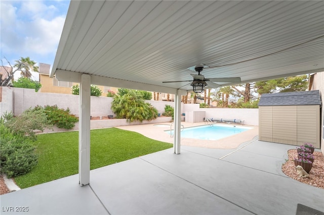 9578 Teton Vista Ave, Las Vegas, NV 89117 - view of swimming pool with a storage unit, a patio area, a fenced backyard, and ceiling fan