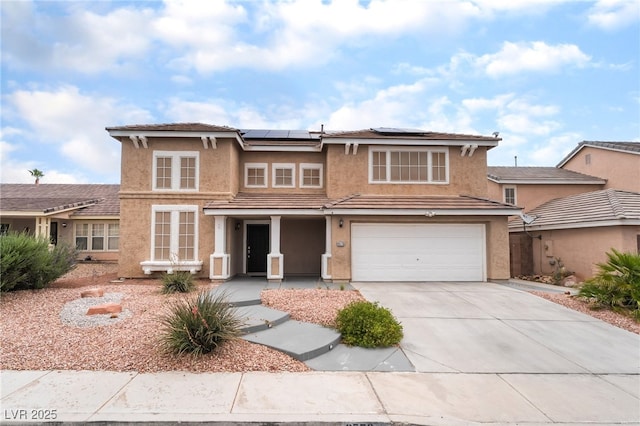 9578 Teton Vista Ave, Las Vegas, NV 89117 - traditional-style home featuring concrete driveway, stucco siding, solar panels, and an attached garage