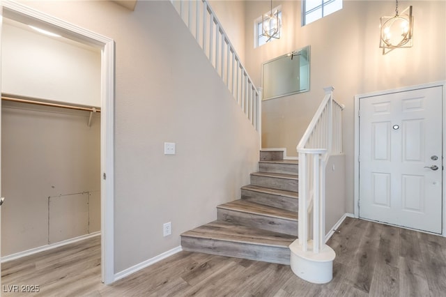 9578 Teton Vista Ave, Las Vegas, NV 89117 - foyer entrance featuring wood finished floors, stairway, and a towering ceiling
