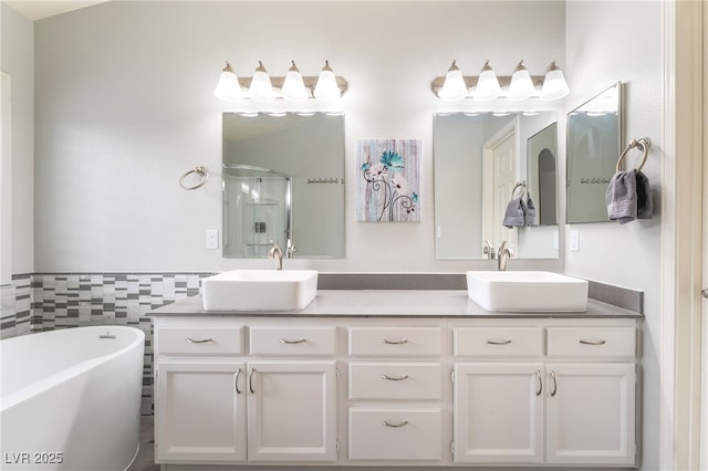 9578 Teton Vista Ave, Las Vegas, NV 89117 - bathroom with double vanity, a freestanding tub, and an enclosed shower