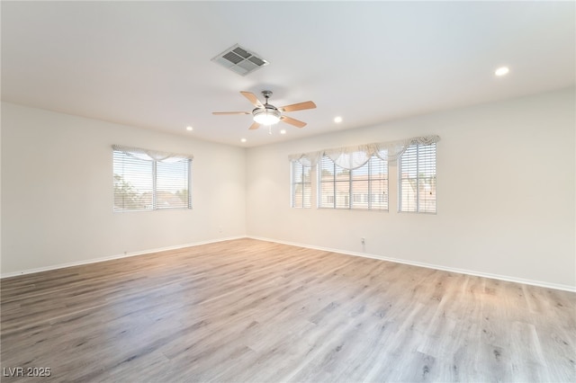 9578 Teton Vista Ave, Las Vegas, NV 89117 - empty room with plenty of natural light, a ceiling fan, recessed lighting, and light wood-style floors