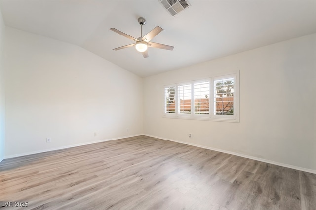9578 Teton Vista Ave, Las Vegas, NV 89117 - unfurnished room featuring vaulted ceiling, wood finished floors, and a ceiling fan