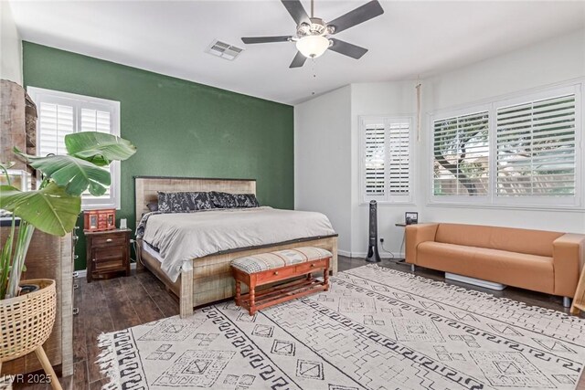 1521 Antler Creek St, North Las Vegas, NV 89084 - bedroom with multiple windows, wood finished floors, and a ceiling fan