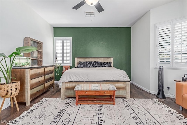 1521 Antler Creek St, North Las Vegas, NV 89084 - bedroom with wood finished floors, an accent wall, and ceiling fan