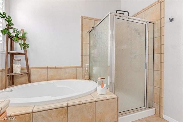 1521 Antler Creek St, North Las Vegas, NV 89084 - bathroom featuring a shower stall, a bath, and tile patterned floors