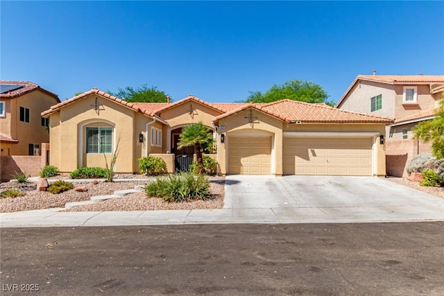 1521 Antler Creek St, North Las Vegas, NV 89084 - mediterranean / spanish home with a garage, stucco siding, driveway, and a tiled roof