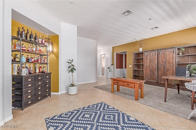 1521 Antler Creek St, North Las Vegas, NV 89084 - home office with light tile patterned floors and a bar