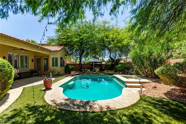 1521 Antler Creek St, North Las Vegas, NV 89084 - view of swimming pool featuring a fenced backyard, french doors, ceiling fan, and a pool with connected hot tub