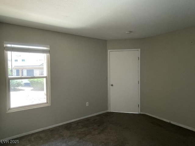 2300 E Silverado Ranch Blvd Unit 1180, Las Vegas, NV 89183 - carpeted empty room with healthy amount of natural light