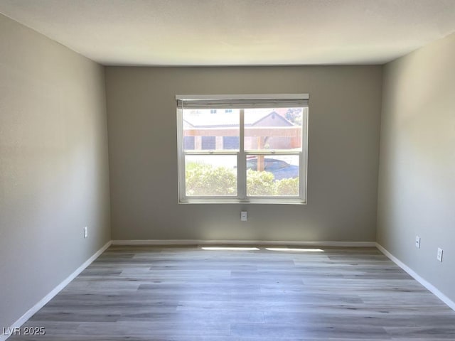 2300 E Silverado Ranch Blvd Unit 1180, Las Vegas, NV 89183 - empty room featuring wood finished floors
