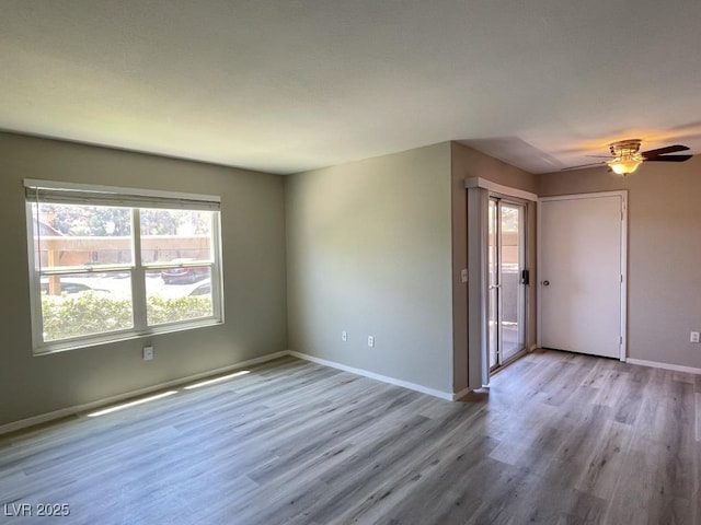 2300 E Silverado Ranch Blvd Unit 1180, Las Vegas, NV 89183 - empty room with wood finished floors and ceiling fan