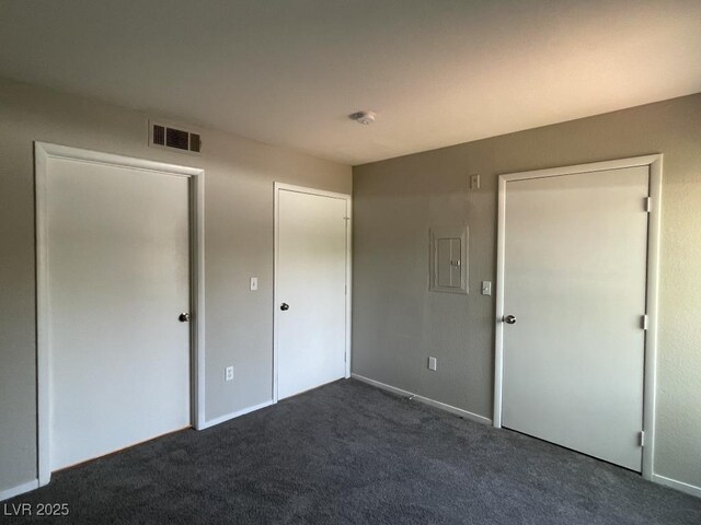 2300 E Silverado Ranch Blvd Unit 1180, Las Vegas, NV 89183 - unfurnished bedroom featuring dark carpet and electric panel