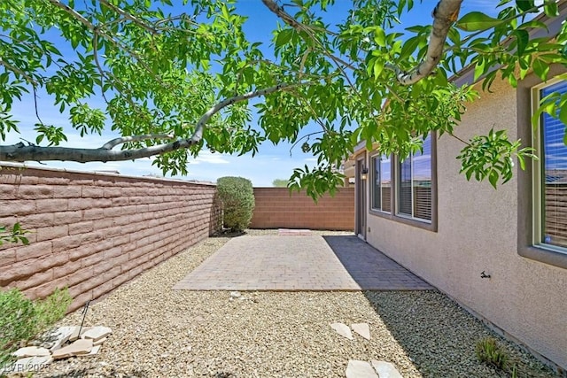 7558 Schuders Ave, Las Vegas, NV 89178 - fenced backyard featuring a patio area