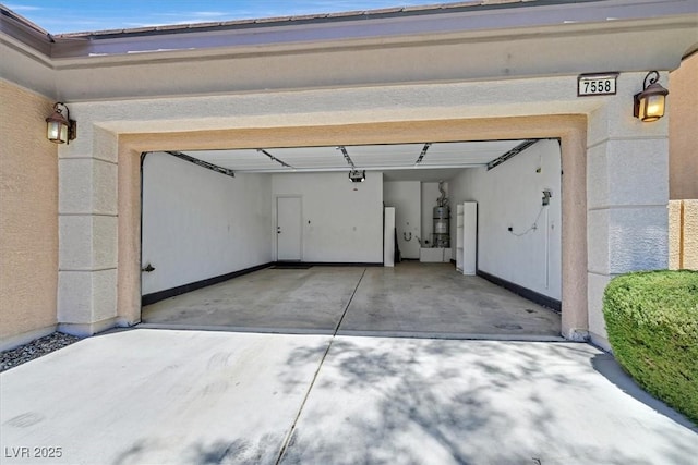 7558 Schuders Ave, Las Vegas, NV 89178 - garage featuring a garage door opener and driveway