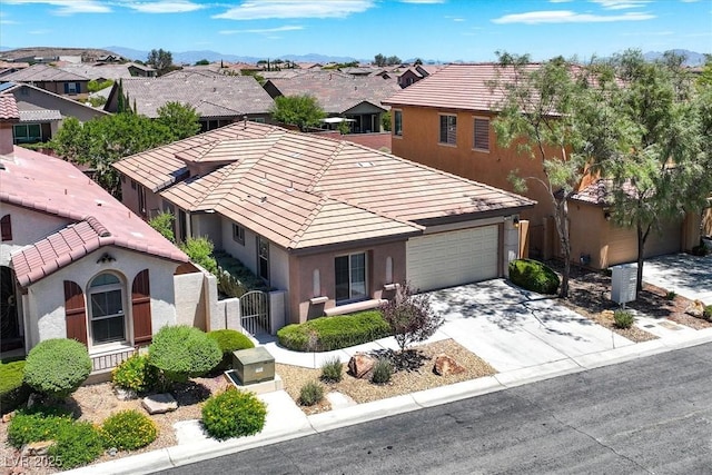 7558 Schuders Ave, Las Vegas, NV 89178 - view of front of house featuring stucco siding, a residential view, a gate, driveway, and a tile roof