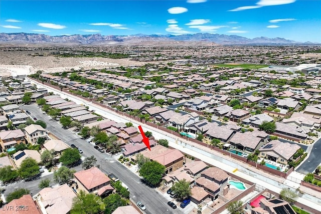 7558 Schuders Ave, Las Vegas, NV 89178 - aerial perspective of suburban area featuring a mountain backdrop