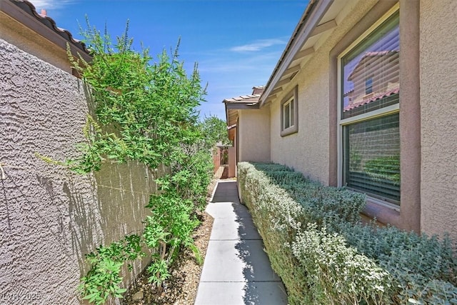 7558 Schuders Ave, Las Vegas, NV 89178 - view of side of home with stucco siding