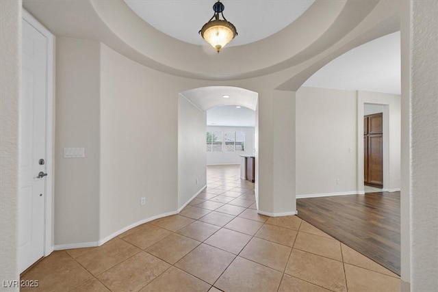 7558 Schuders Ave, Las Vegas, NV 89178 - hall with arched walkways and light tile patterned floors