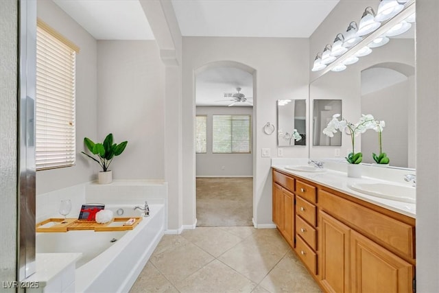 7558 Schuders Ave, Las Vegas, NV 89178 - bathroom featuring double vanity, a garden tub, tile patterned flooring, and ceiling fan