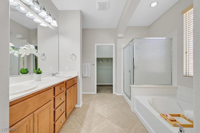 7558 Schuders Ave, Las Vegas, NV 89178 - bathroom featuring a shower stall, double vanity, plenty of natural light, and a garden tub