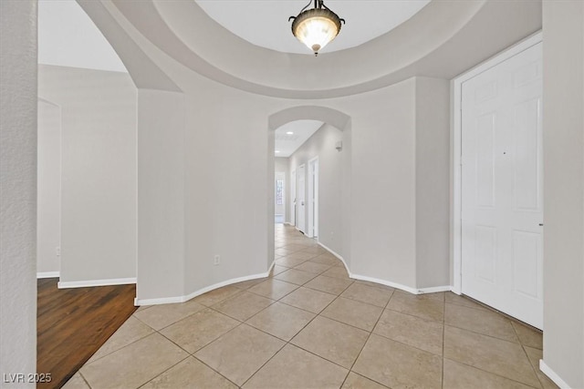 7558 Schuders Ave, Las Vegas, NV 89178 - unfurnished room featuring arched walkways, tile patterned flooring, and recessed lighting