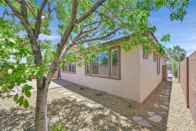7558 Schuders Ave, Las Vegas, NV 89178 - view of property exterior with stucco siding