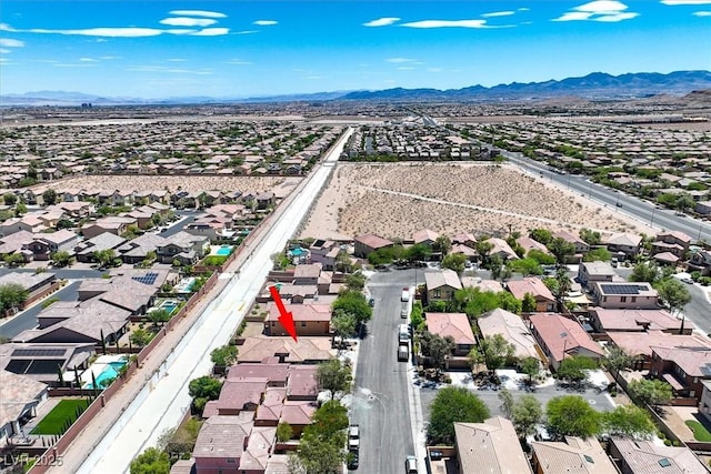 7558 Schuders Ave, Las Vegas, NV 89178 - aerial perspective of suburban area featuring a mountainous background