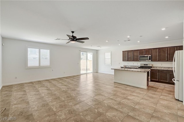 138 Red Sandstone Ave, North Las Vegas, NV 89031 - kitchen with stainless steel appliances, healthy amount of natural light, recessed lighting, a ceiling fan, and open floor plan
