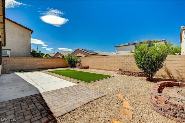 138 Red Sandstone Ave, North Las Vegas, NV 89031 - fenced backyard with a patio area