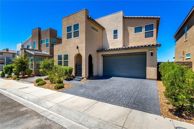 3244 Timorasso Ave, Henderson, NV 89044 - view of front facade featuring stucco siding, driveway, a garage, and a tiled roof
