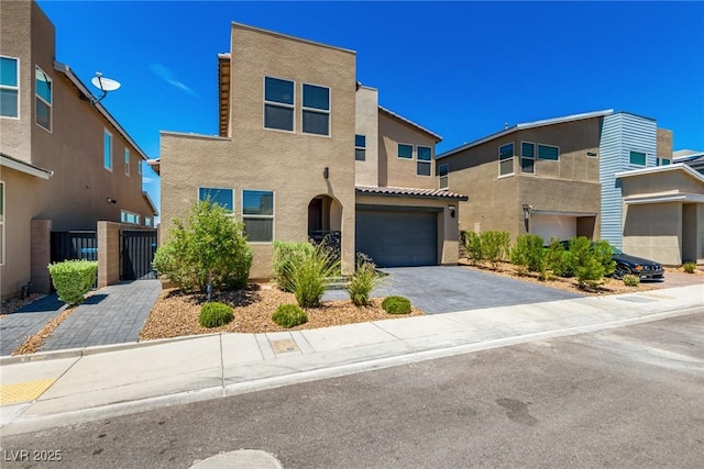 3244 Timorasso Ave, Henderson, NV 89044 - view of front facade featuring stucco siding, driveway, an attached garage, and a tile roof