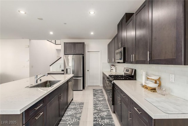 3244 Timorasso Ave, Henderson, NV 89044 - kitchen featuring stainless steel appliances, dark brown cabinetry, decorative backsplash, and recessed lighting