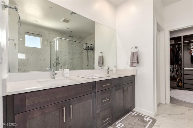 3244 Timorasso Ave, Henderson, NV 89044 - full bathroom with marble look tile flooring, a marble finish shower, double vanity, and a walk in closet