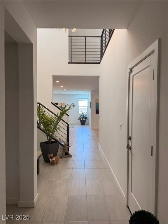3244 Timorasso Ave, Henderson, NV 89044 - hallway featuring light tile patterned floors and a high ceiling